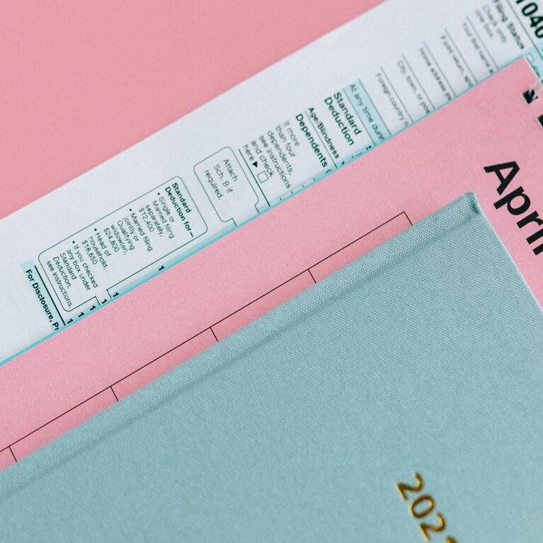 A yearly planner a tax documents and a calendar